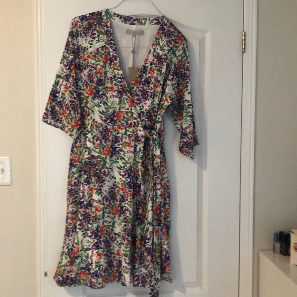 Beautiful never worn wrap over dress U.K brand name. It’s a size 14